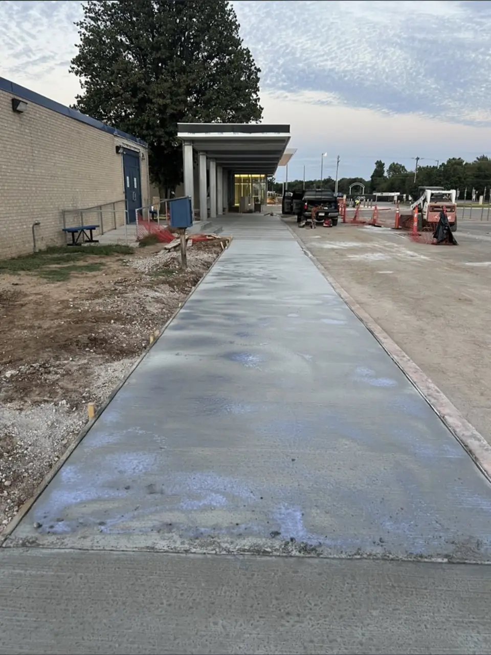 New concrete sidewalk leading to the covered entrance at Star Spencer High School, Spencer, OK